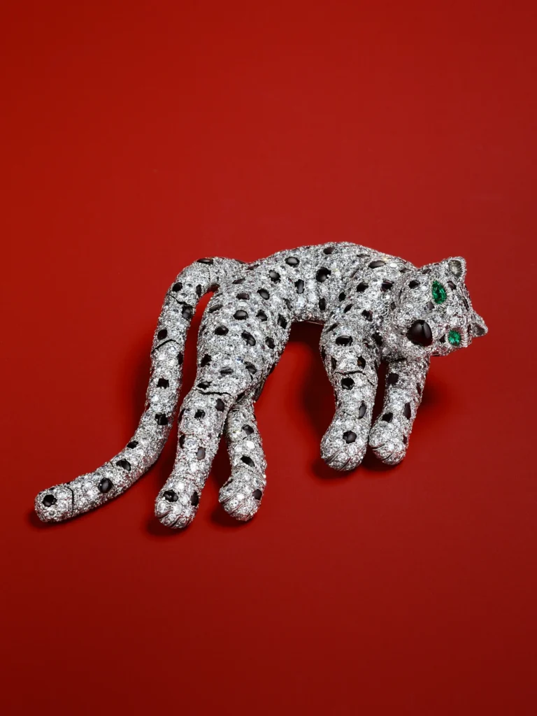 CARTIER ONYX EMERALD AND DIAMOND PANTHERE BROOCH